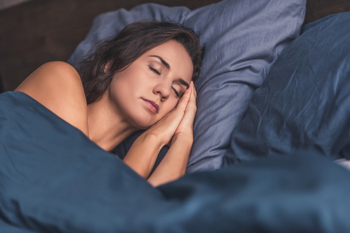 Young woman in bed