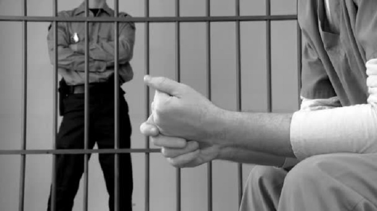 depositphotos_78011930-stock-video-prisoner-sitting-in-prison-cell