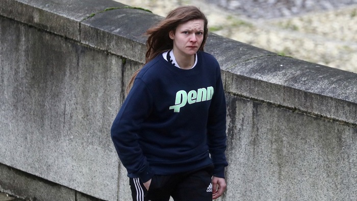 Gemma Watts, a British woman who pleaded guilty to posing as a teenage boy to sexually groom young girls, walks to the Winchester Crown Court in Winchester